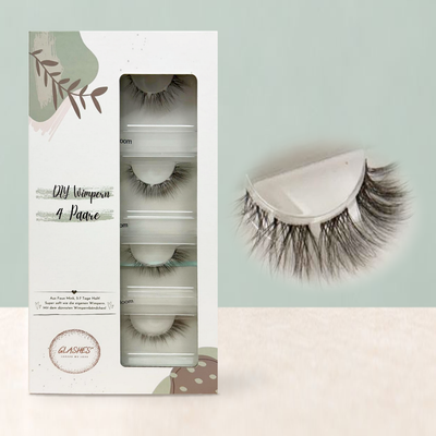 Angel Bloom Braun – stehende Glashes 4er-Box mit Detailaufnahme der braunen Wimpern.